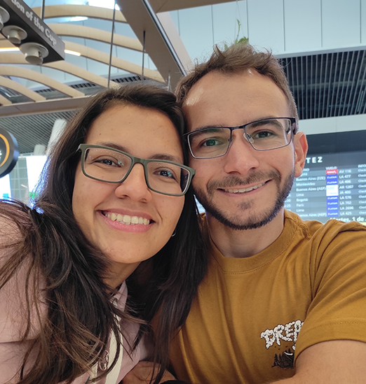 a couple of persons smiling