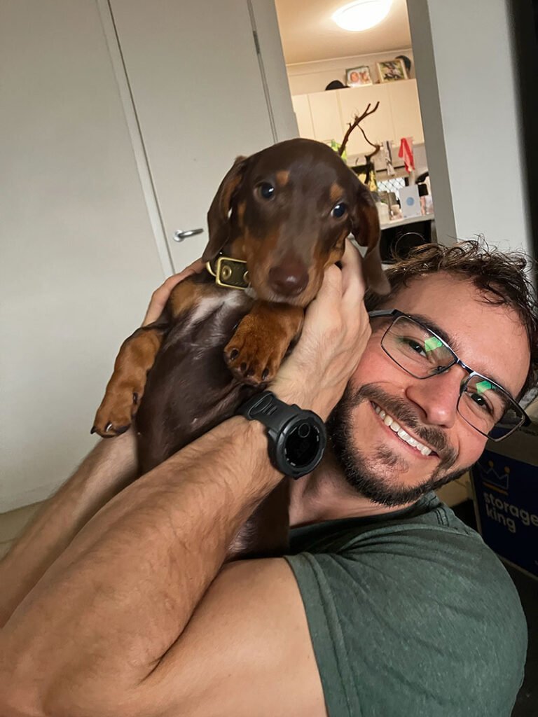 smiling-man-huging-dog